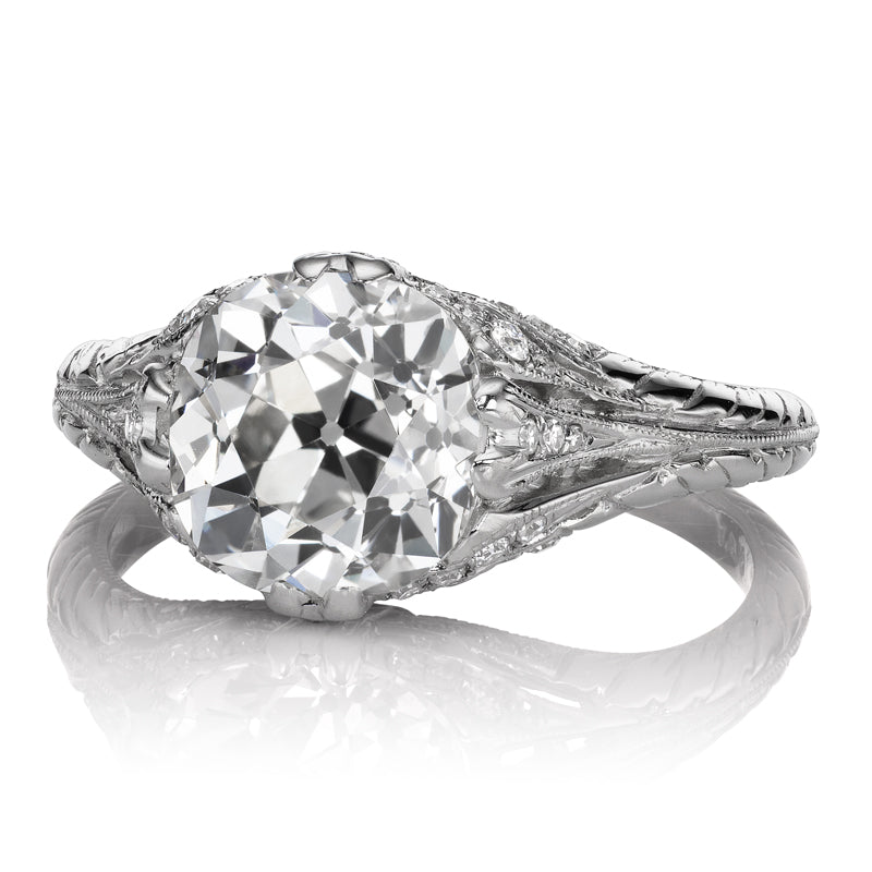 Amma 2.78 features a vintage-style silver ring with an intricate design and a large round sparkling center stone.