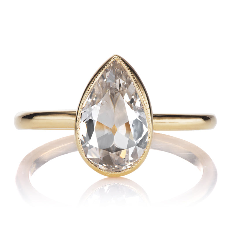 1 Carat Pear Cut Diamond in 18kt Yellow Gold Bezel Setting with Millegrain