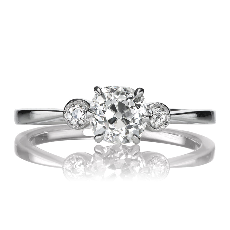 Dainty 0.85 Carat Old Mine Cut Diamond with Side Stones in Platinum Setting