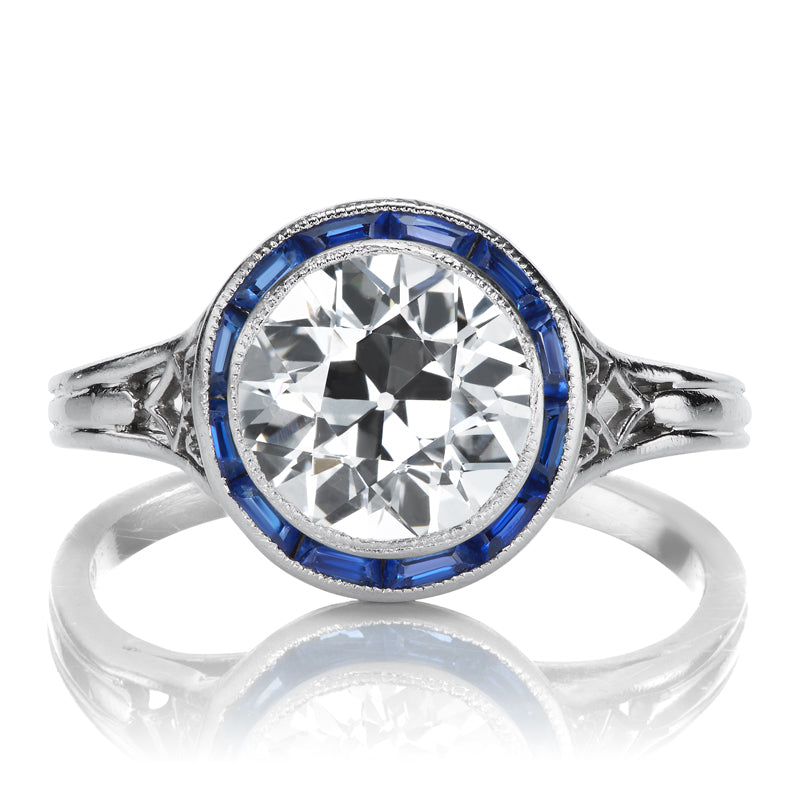 Antique Tiffany & Co Ring with a Transitional Cut Diamond and Sapphire Halo