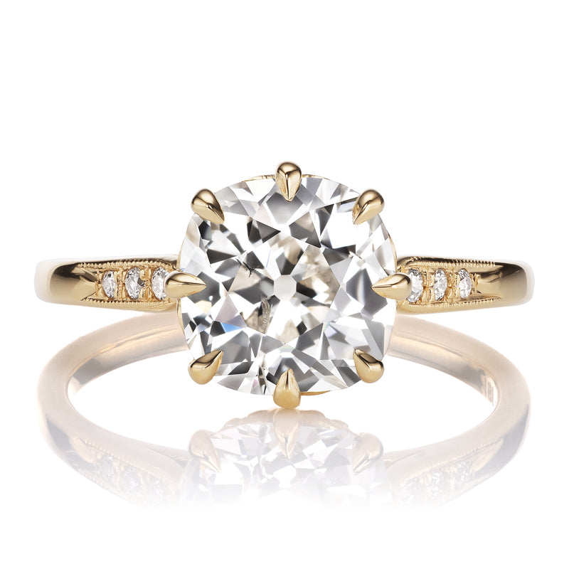 Cushiony Old Mine Cut Ring with Side Stones and Intricate Basket