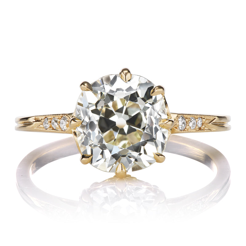 Old Mine Cut Diamond Engagement Ring with Side Stones and Intricate Basket