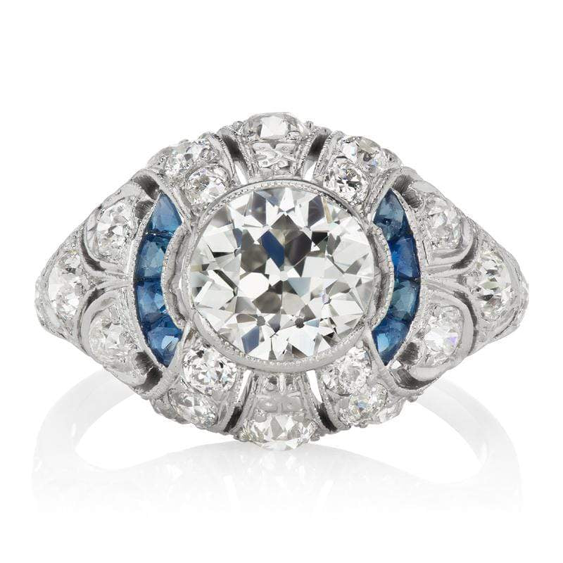 Unique Diamond & Sapphire Halo Engagement Ring