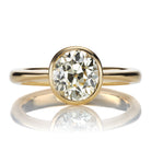 Antique Oval Cut Diamond Engagement Ring in 18kt Yellow Gold Bezel Setting