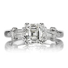 Edwardian Era Antique 1.09 Carat Emerald Cut Diamond Engagement Ring with Scroll Design