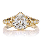 1.83 Carat Pear Cut Diamond in 18kt Yellow Gold with Swirling Filigree and Side Diamonds