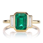 Bright Green Zambian Emerald Ring in 18kt Gold Bezel Setting with Diamond Baguettes
