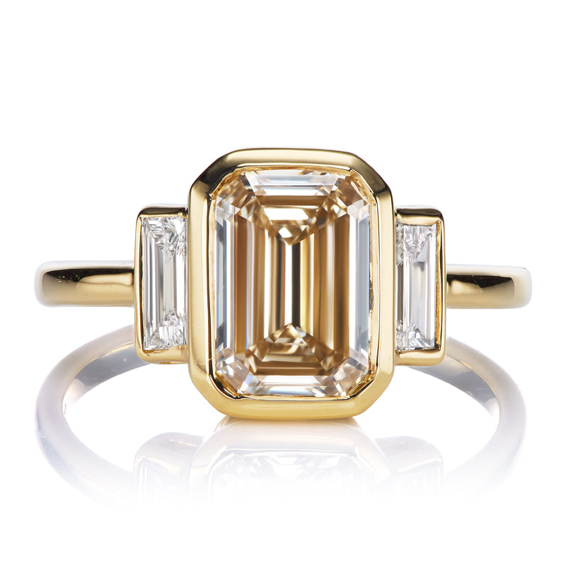 Art Deco Inspired Ring with a 2 Carat Champagne Colored Emerald Cut Diamond