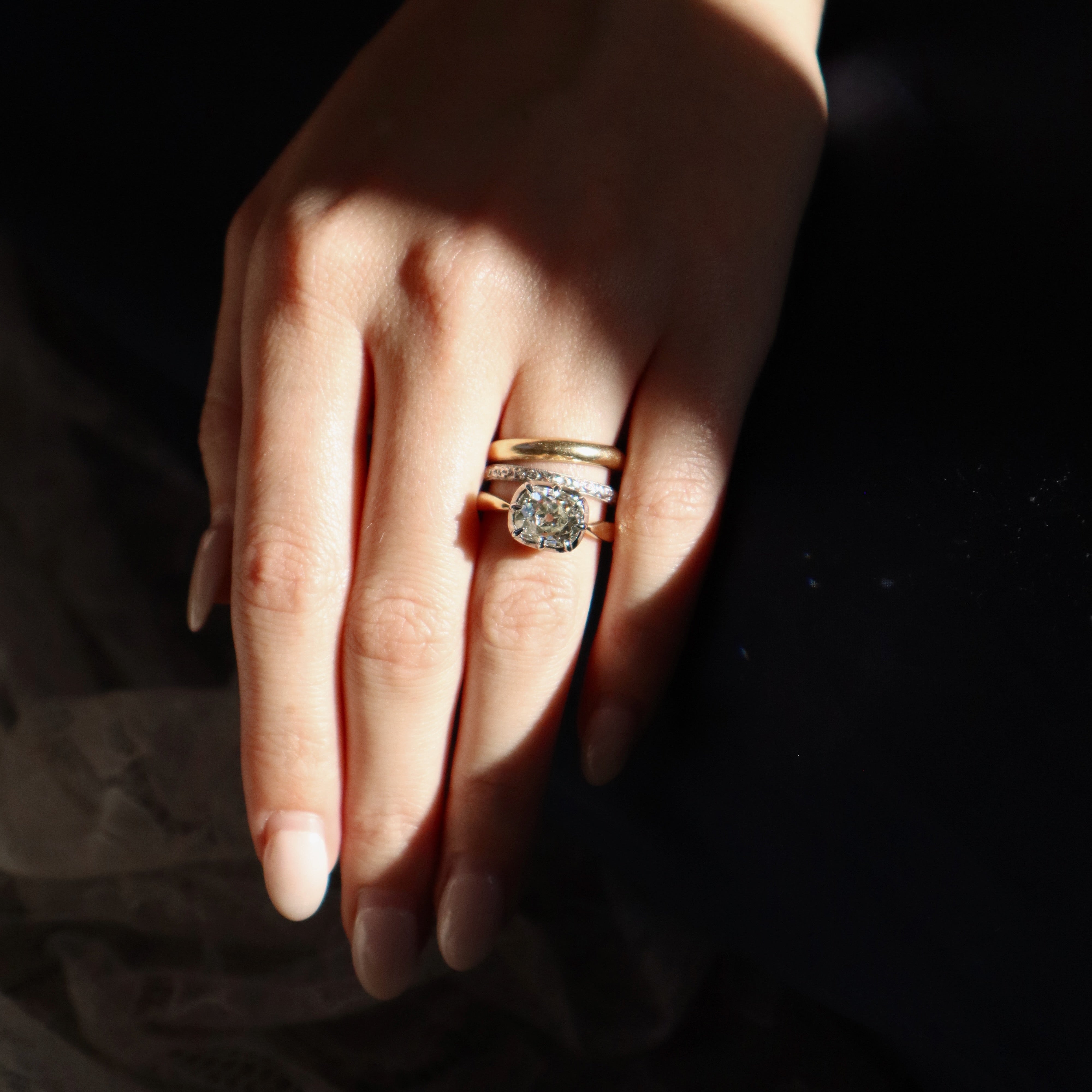 Bright Old Mine Cut Diamond in Two-Tone East-West Collet Setting