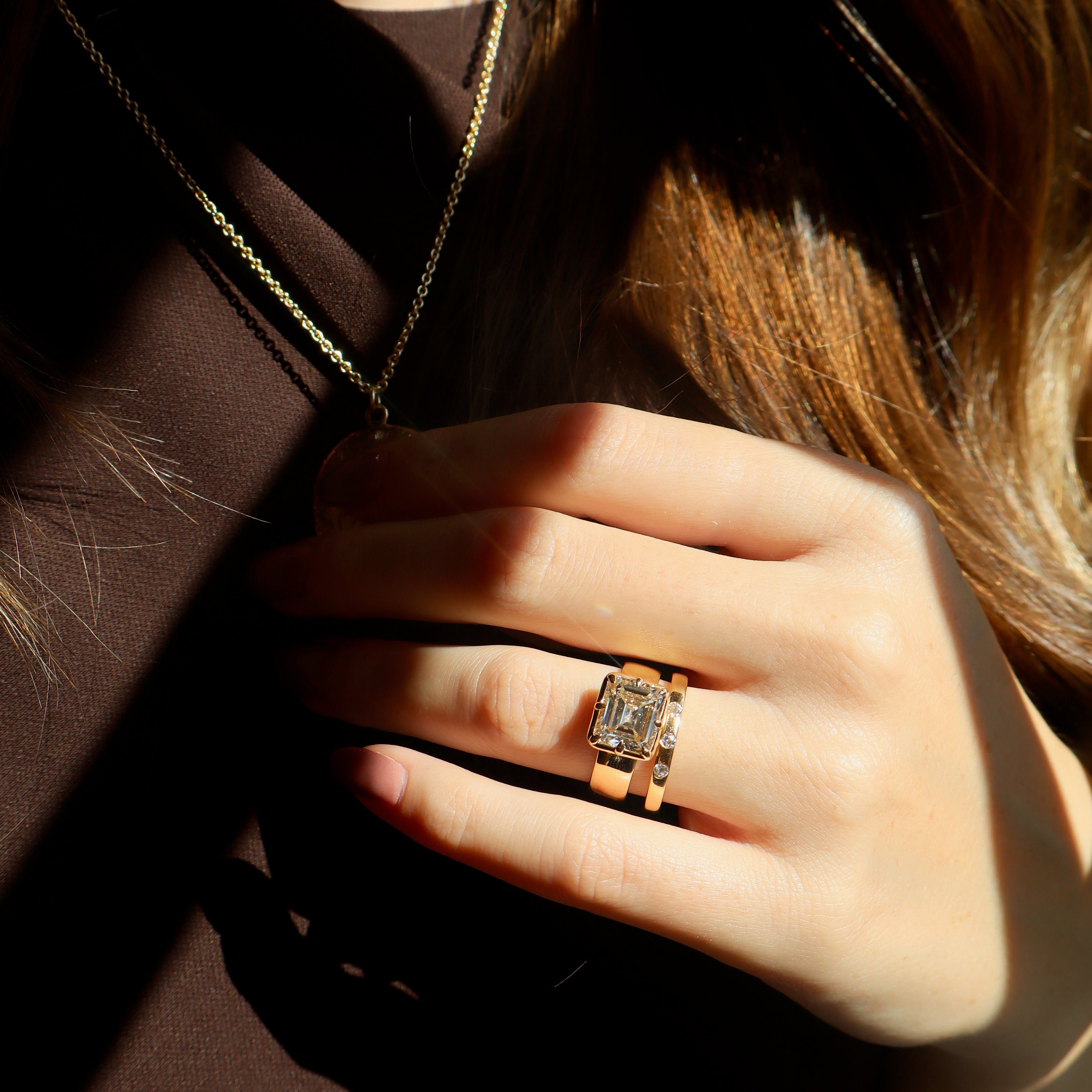 East-West Set Emerald Cut Diamond Collet Set in Chunky Yellow Gold