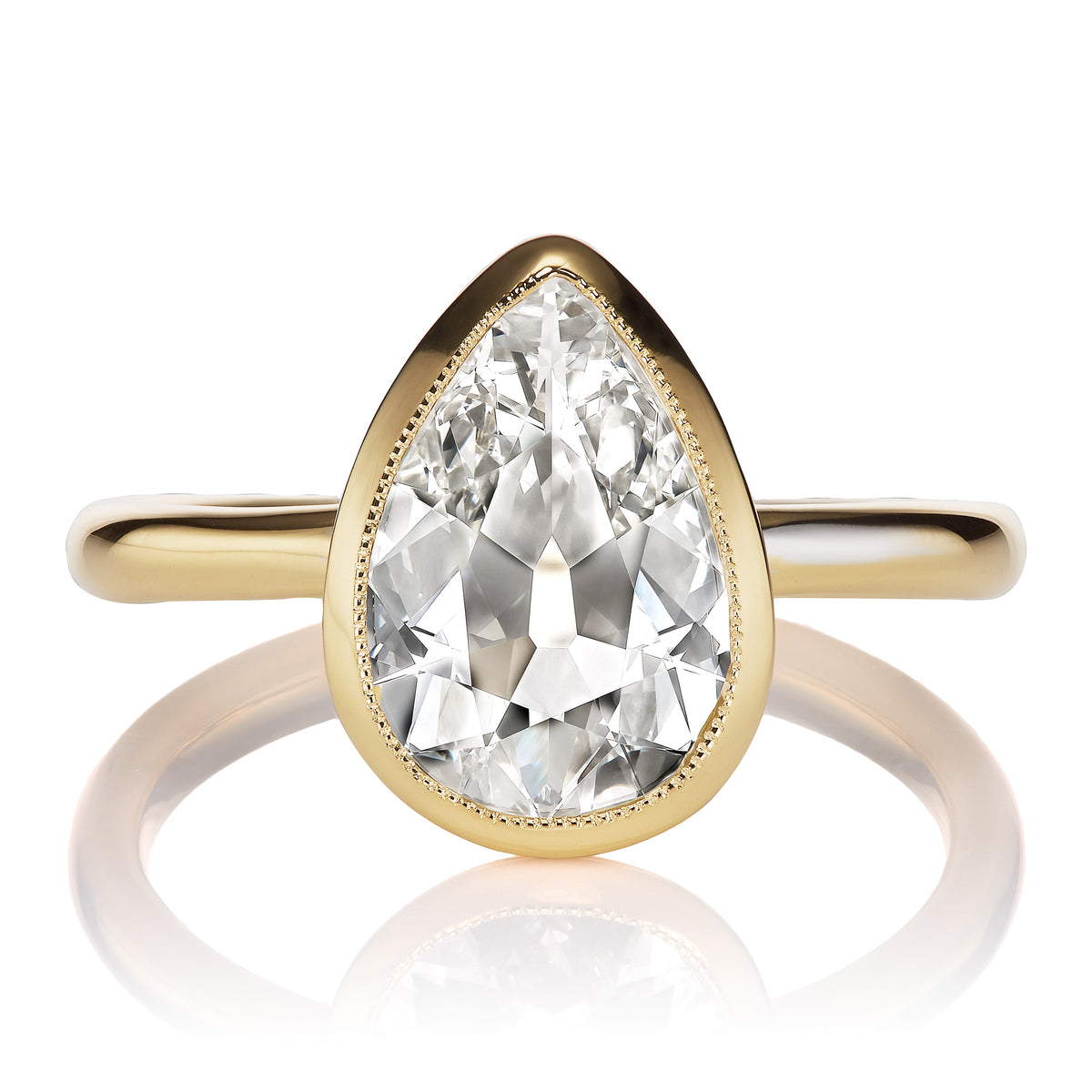 1.5 Carat Pear Cut Diamond in Gold Bezel Setting
