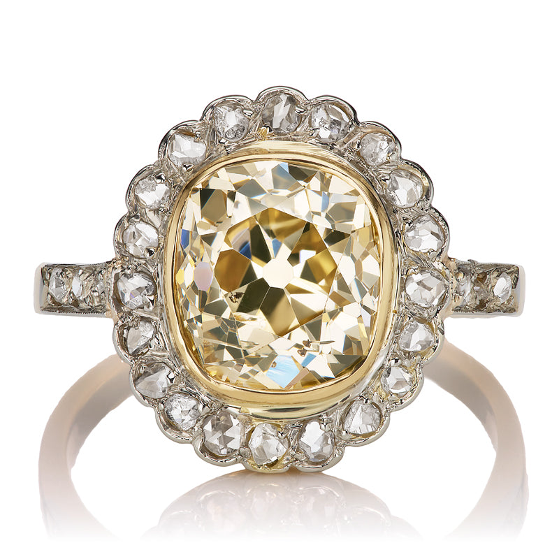 Elongated Warm Old Mine Cut Diamond Antique Engagement Ring with Diamond Halo