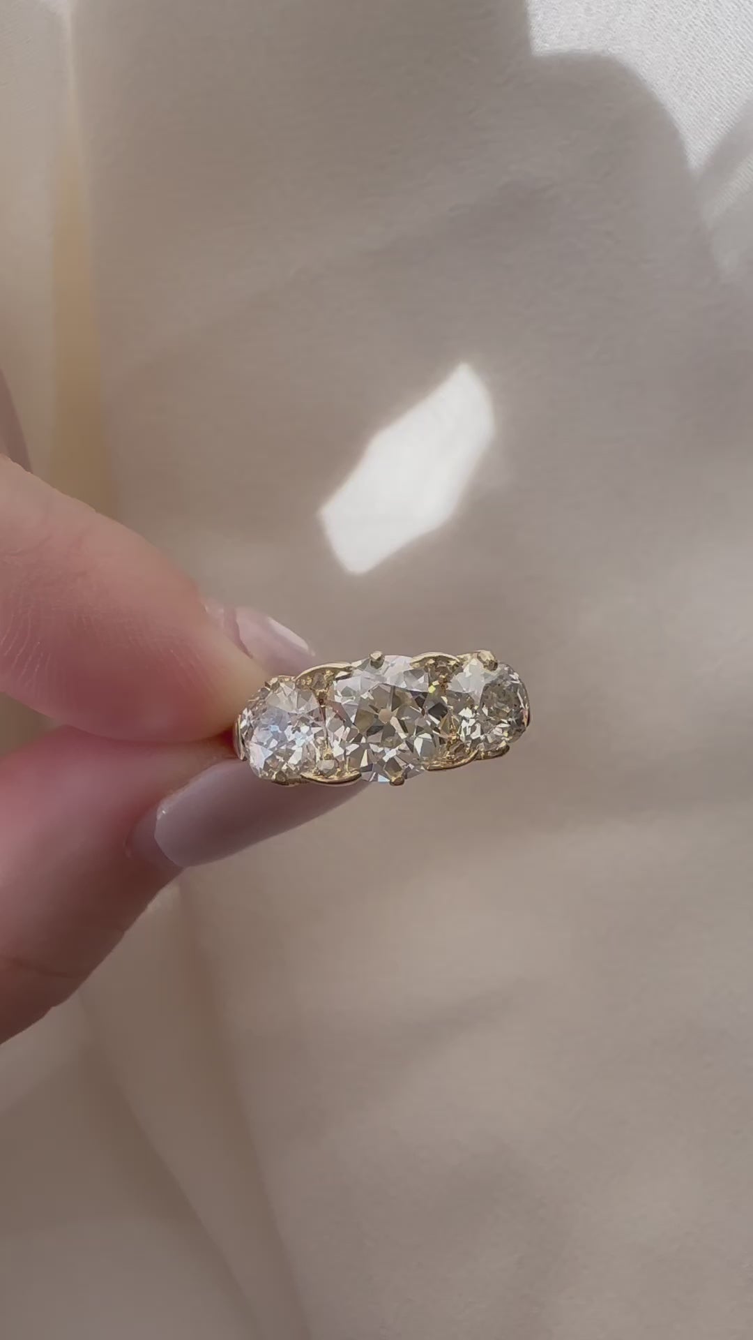 Three-stone Old Mine cut diamond Rings