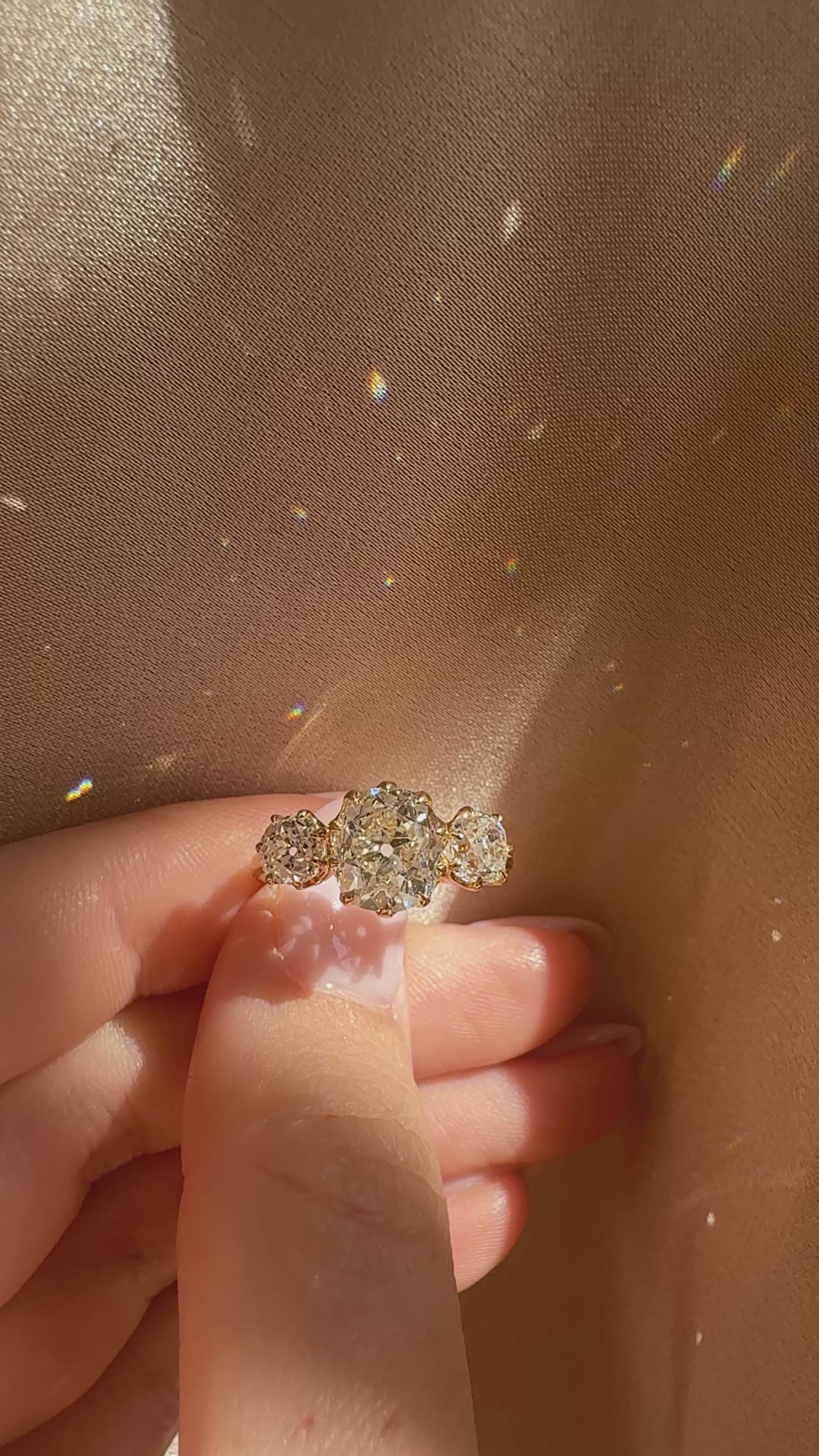 Three-stone Old Mine cut diamond Rings