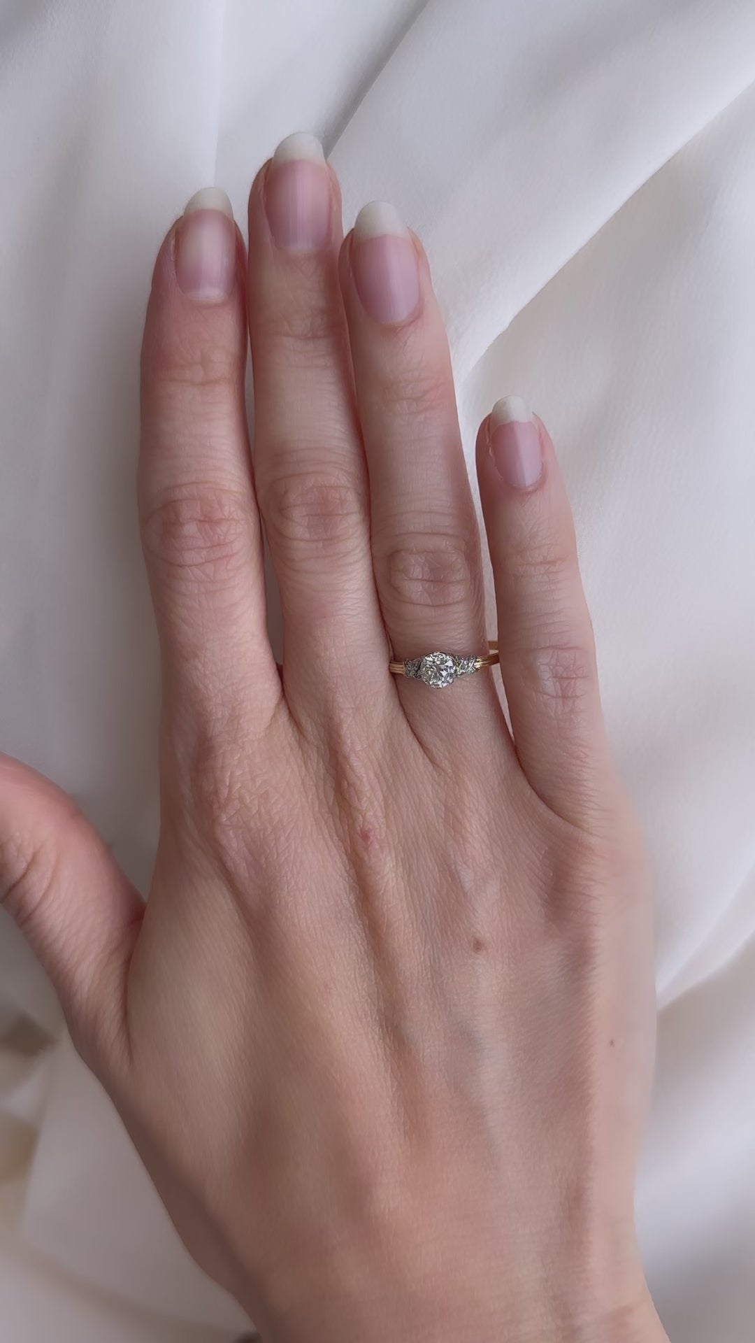 j-k-l color, vs clarity diamond in two-tone setting