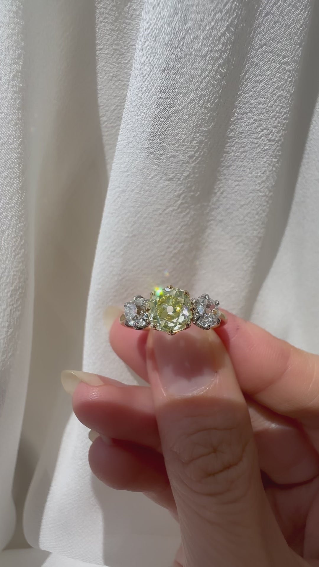 fancy color, vs clarity diamond in two-tone setting