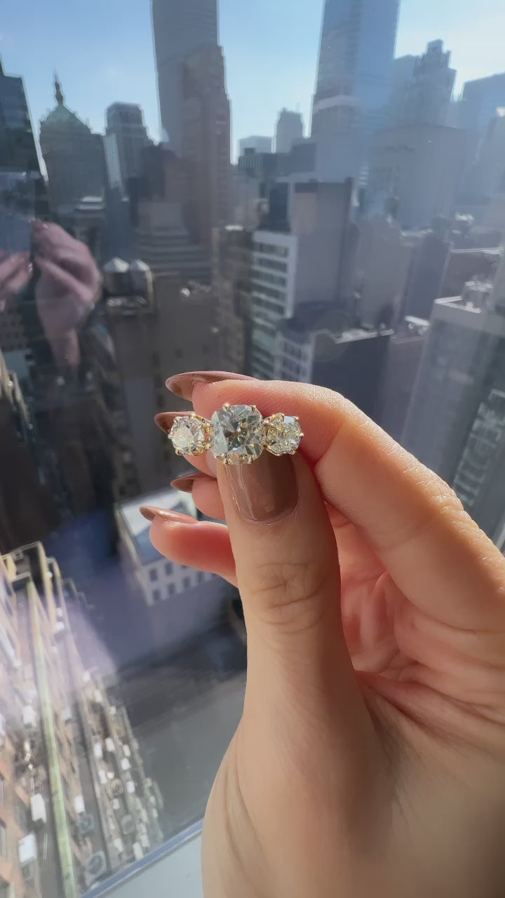 m-z color, si-i clarity diamond in yellow gold setting