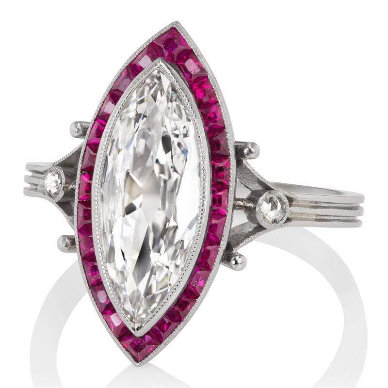 Marquise Cut Diamond Ring with 24 Calibré Cut Rubies