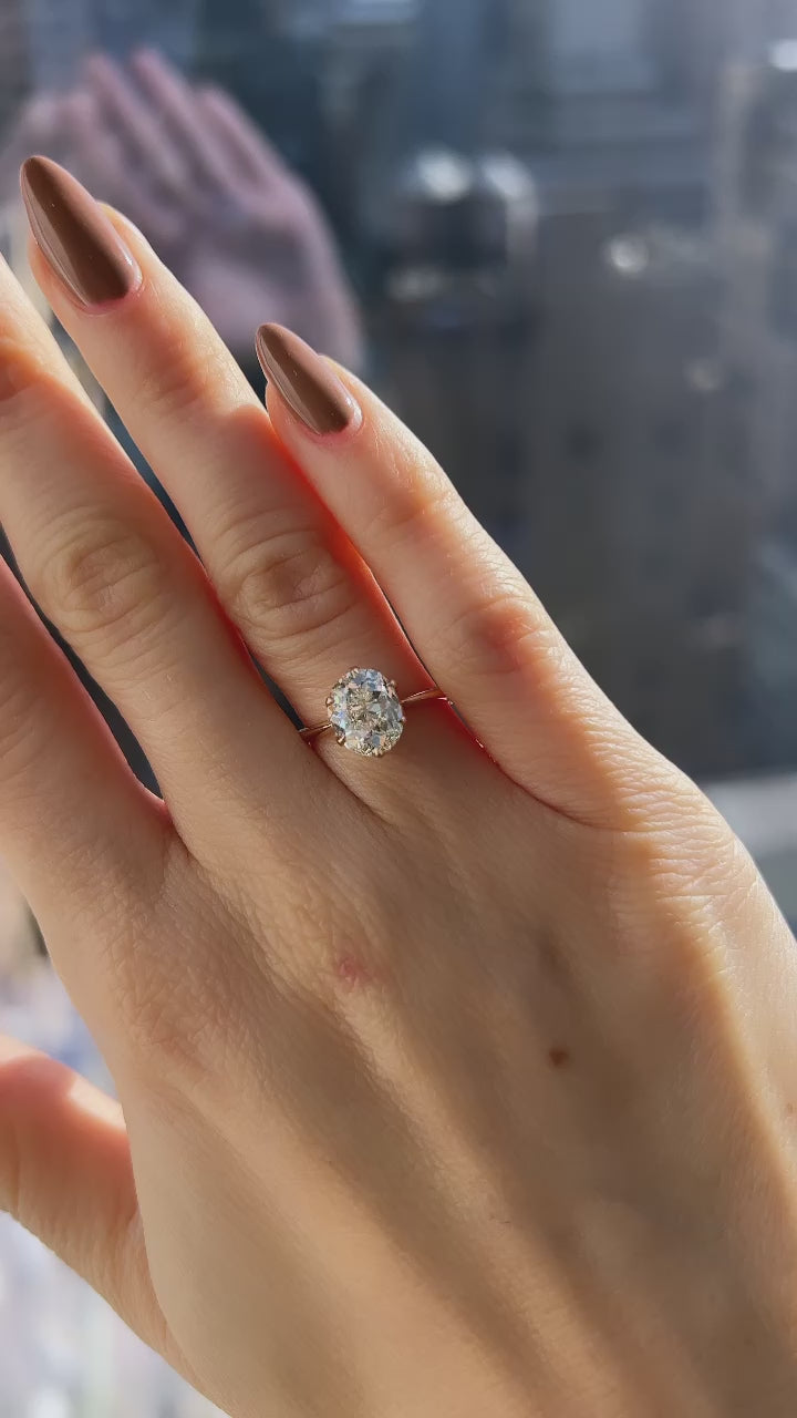 j-k-l color, si-i clarity diamond in yellow gold setting