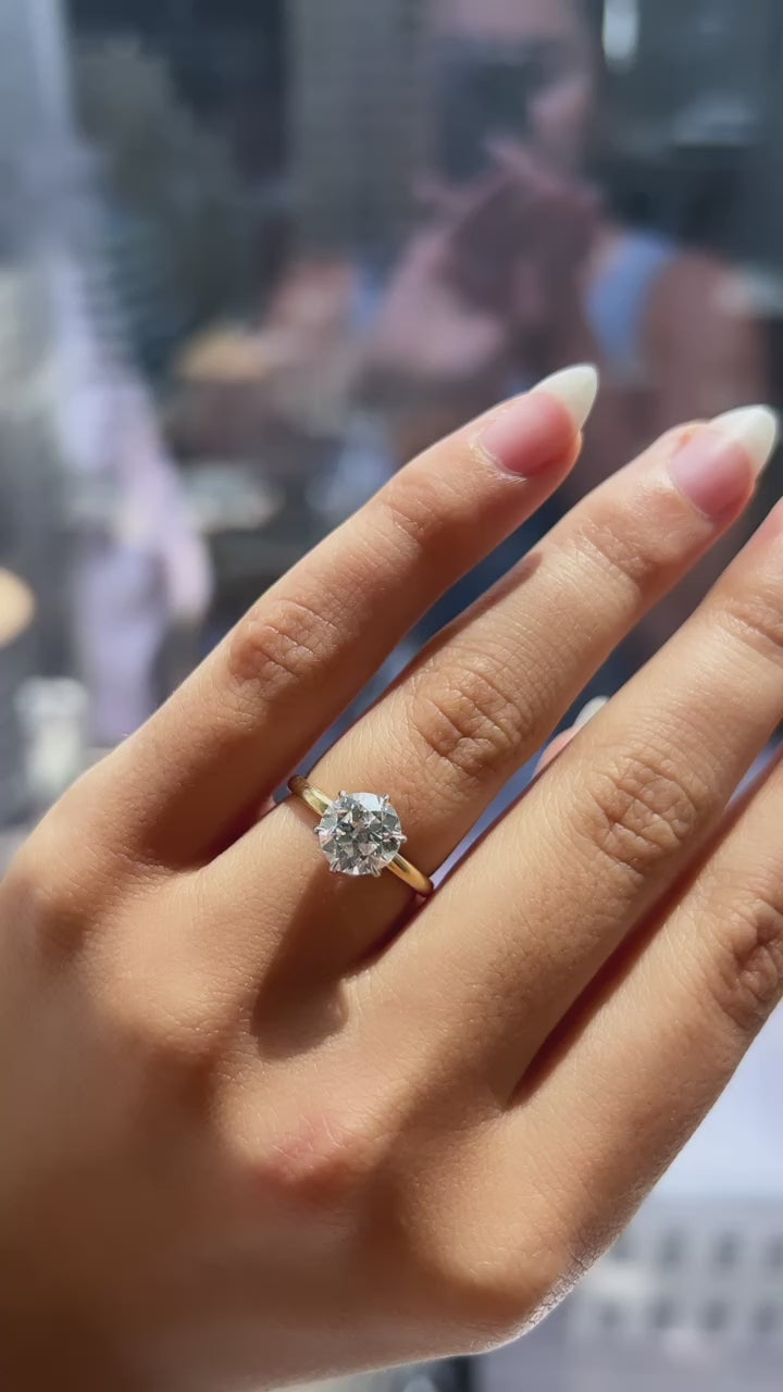 j-k-l color, vs clarity diamond in two-tone setting