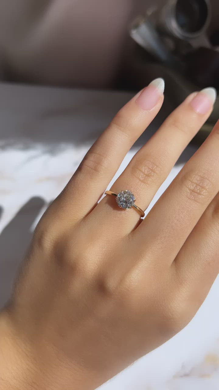 g-h-i color, si-i clarity diamond in yellow gold setting