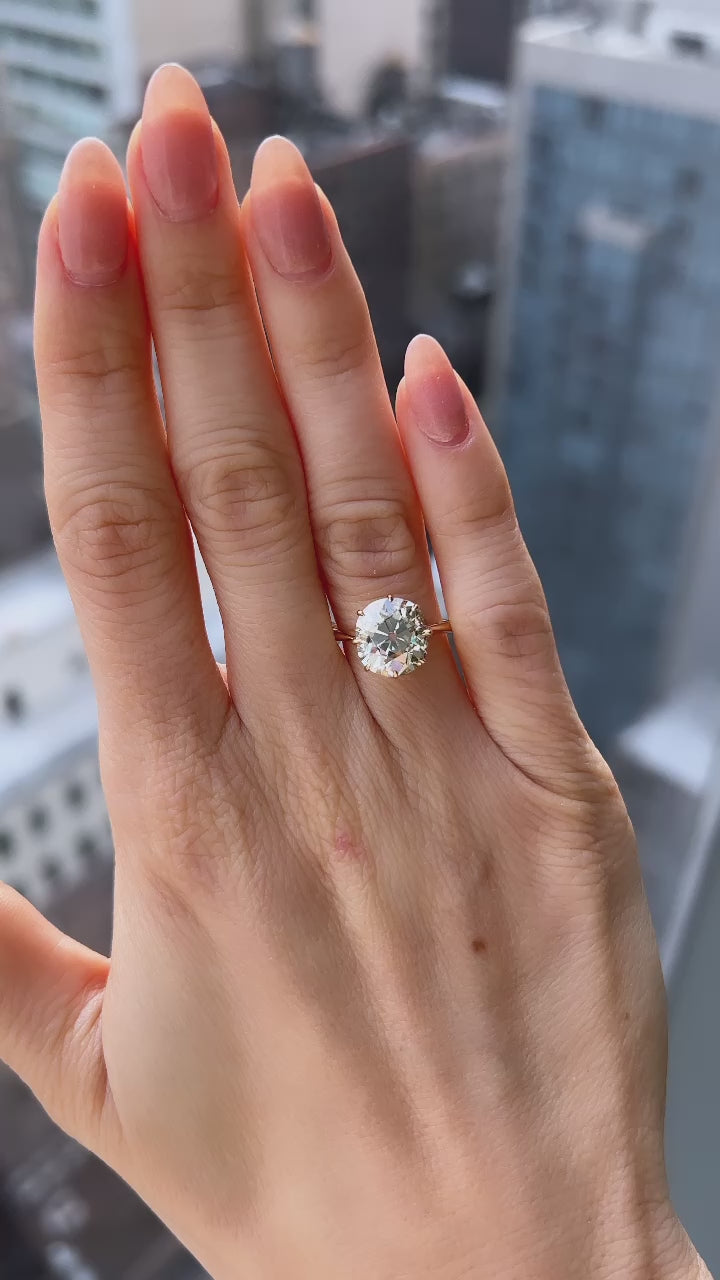 m-z color, vs clarity diamond in yellow gold setting