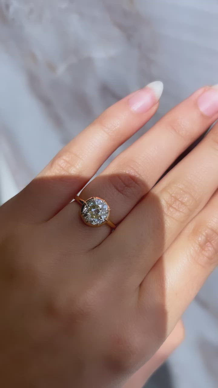 m-z color, si-i clarity diamond in yellow gold setting